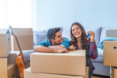 Happy couple holding keys to new home